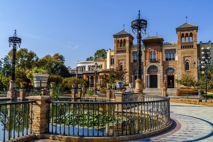 Building with towers and pond in Sevilla, Spain
