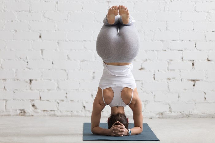4K Fitness Woman Doing Forearm Stand Yoga Pose