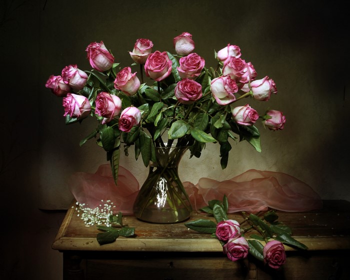 Bouquet of pink and white roses in a vase on a table