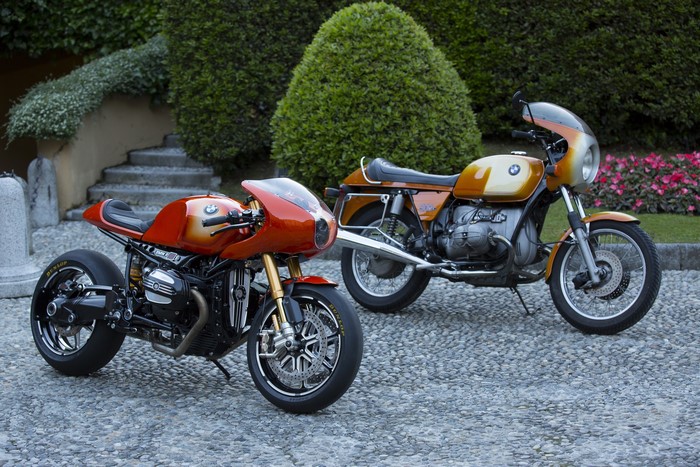 Two BMW R 90 S motorcycles parked on gravel