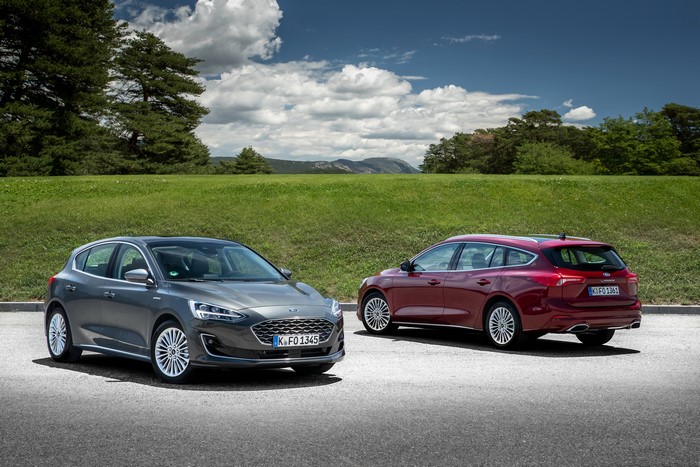 Two Ford Focus cars on a road