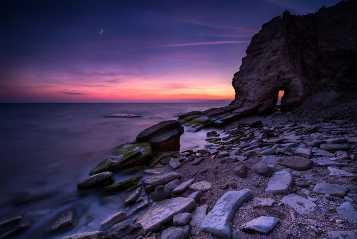Black Sea coast at sunset with moon