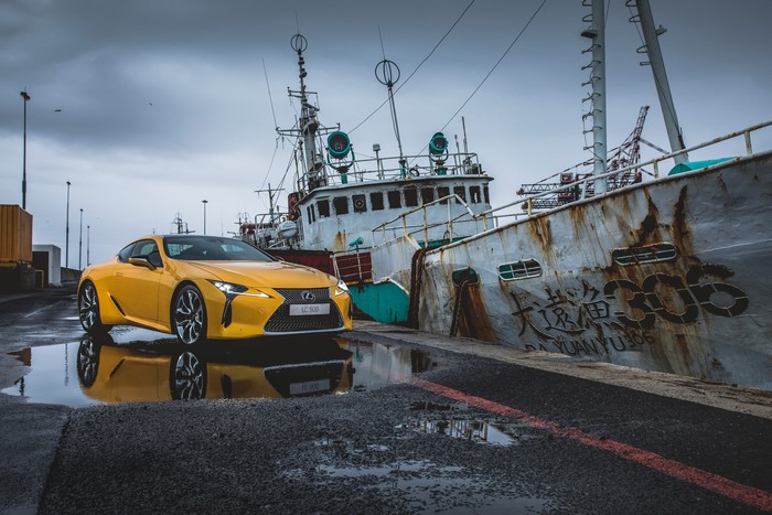 Yellow 2017 Lexus LC 500 by a Ship