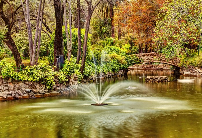 Fountain in a pond at Maria Luisa Park, Seville, Spain
