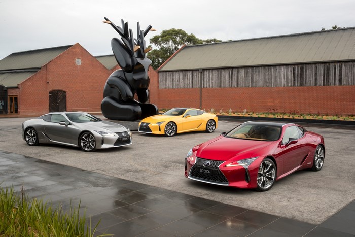 Three Lexus LC cars and sculpture