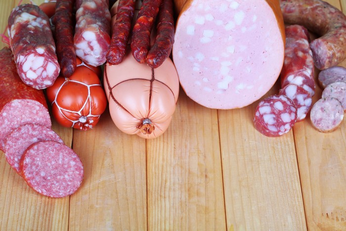 Assortment of sausages on wooden planks