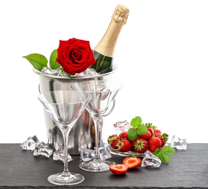 Champagne bottle with rose and strawberries