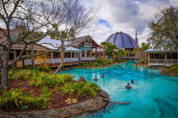 Disney Springs water canal with shops and dome building
