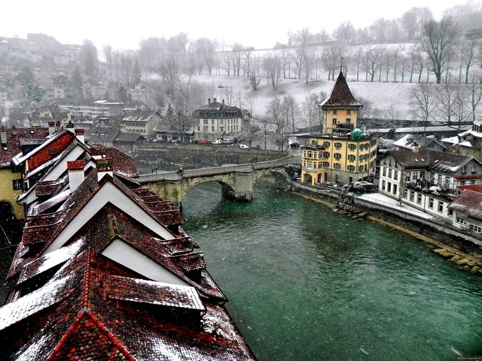 Bern, Switzerland in winter with snow falling