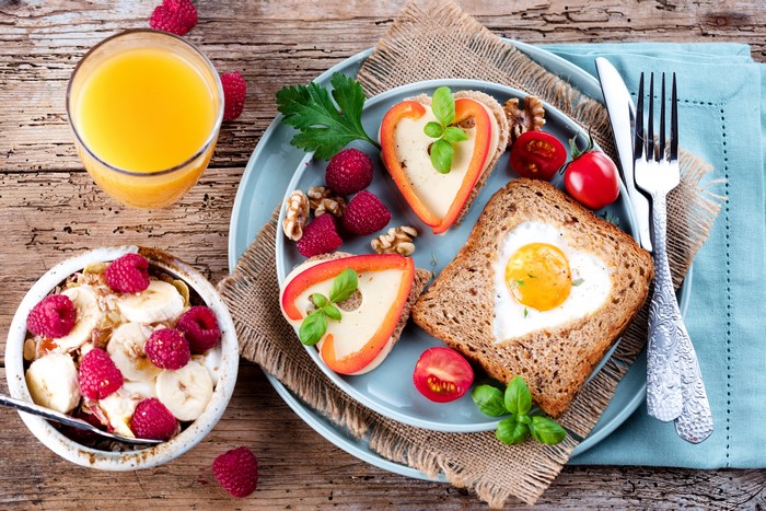 Breakfast with Fried Egg Toast, Muesli, and Orange Juice
