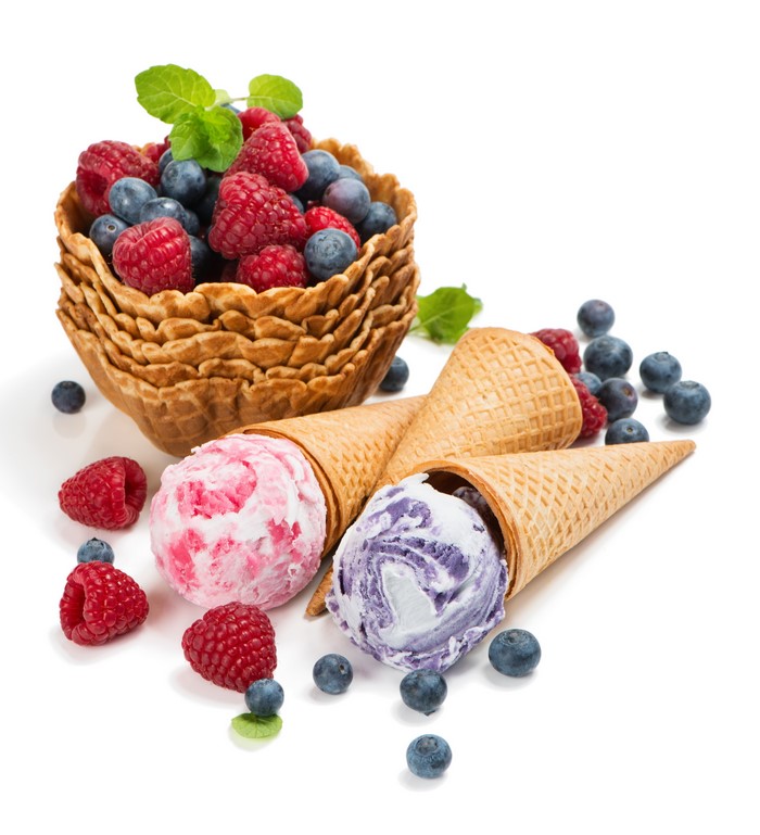 Ice cream cones with berries and waffle bowls