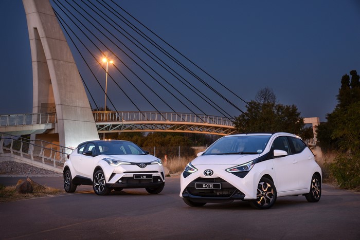 Two white Toyota Aygo and C-HR cars