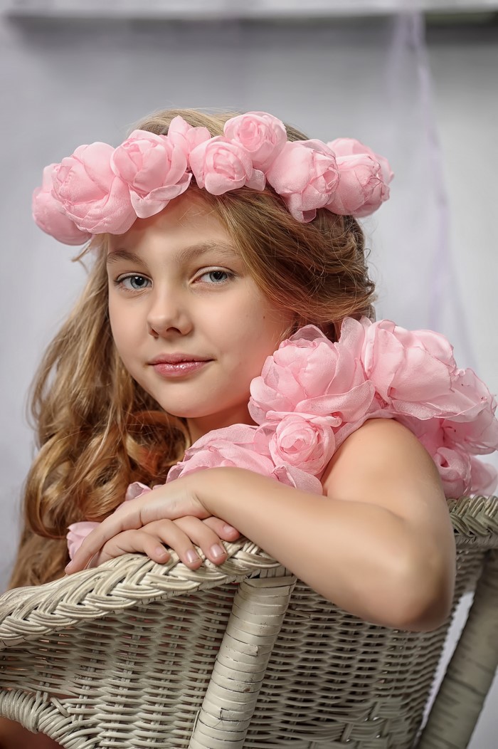 Girl with pink roses in her hair