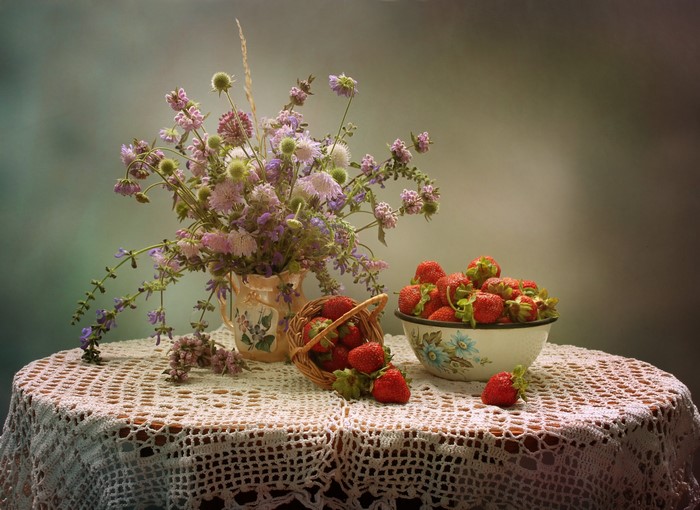 Still life with strawberries and wildflowers