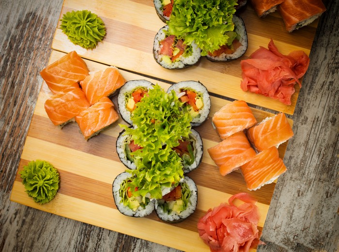Sushi and Salmon on a Cutting Board