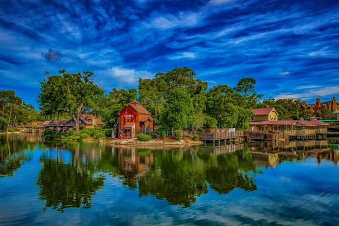 Watermill and houses on a lake in Disneyland, California