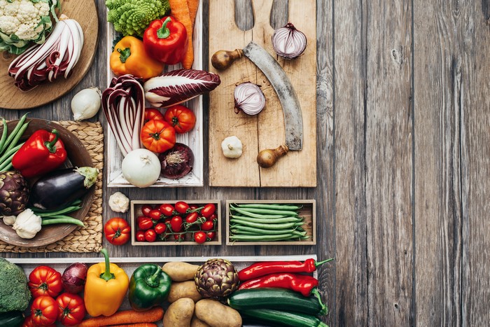 Assortment of Fresh Vegetables on Wood Planks