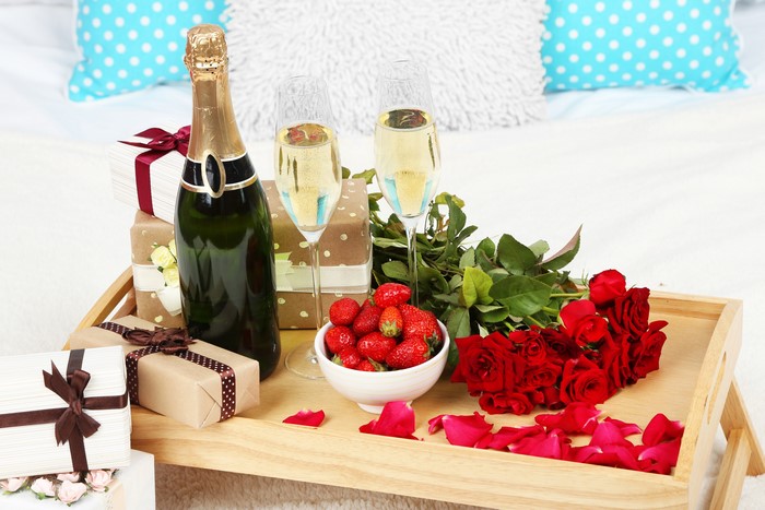Champagne, Strawberries, Roses, and Gifts on a Tray