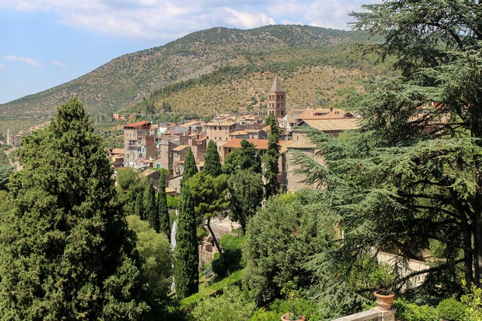 Tivoli, Italy town with bell tower and cypress trees