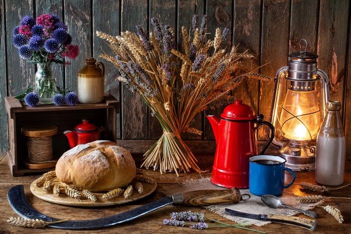 Still-life with bread, flowers, and kerosene lamp