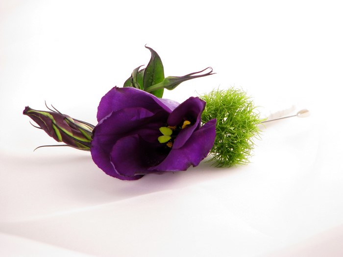 Purple Eustoma flower boutonniere with green filler
