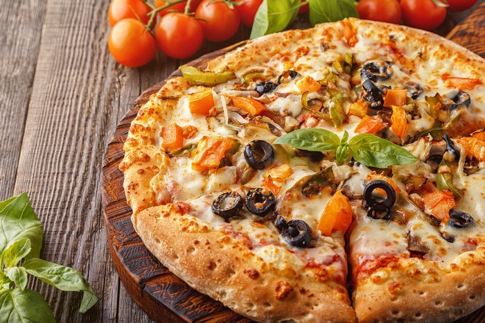 Vegetable pizza with tomatoes and basil
