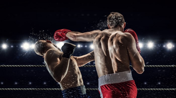 Two boxers fighting in a ring
