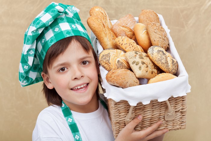 Boy with a basket of bread