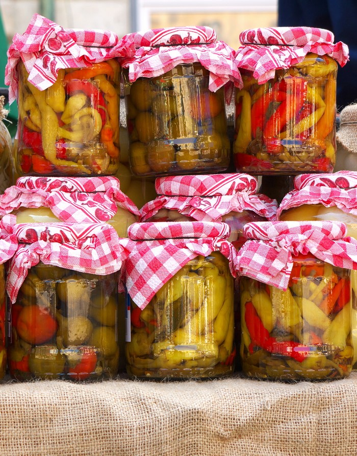 Jars of pickled vegetables and peppers