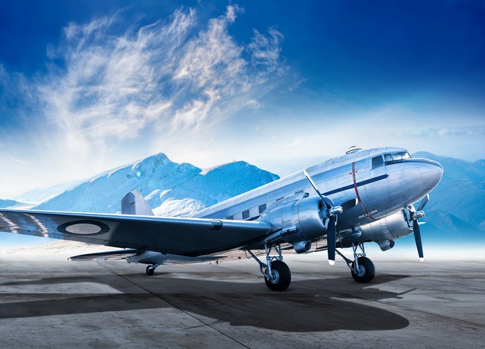 4K Airplane on Tarmac with Mountains