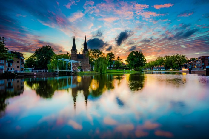 Delft city gate and canal at sunset, Netherlands