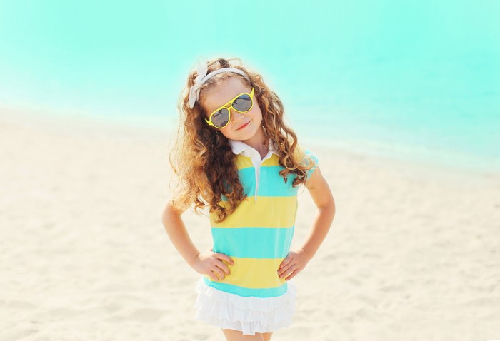 Girl with sunglasses on the beach