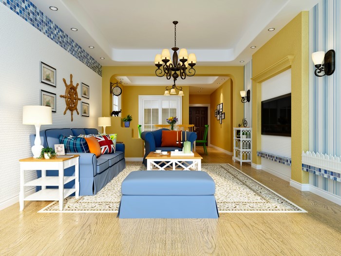 Living room with blue sofa and yellow walls