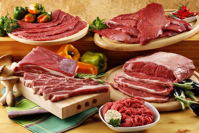 Assortment of Raw Meat Products and Vegetables