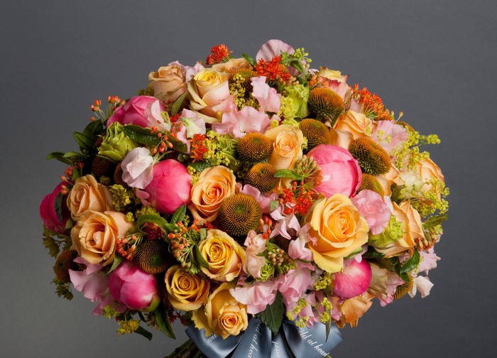 Bouquet of Roses, Peonies, and Matthiola on Gray Background