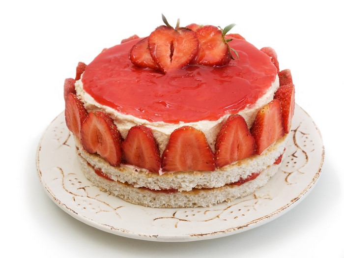 Strawberry cake with cream and jelly on a plate