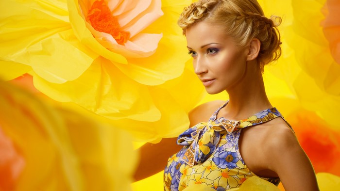 Blonde girl with braided hair in a floral dress