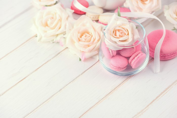 Roses and Pink Macarons on White Wood