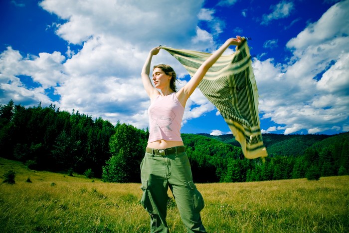 Woman with scarf in a field