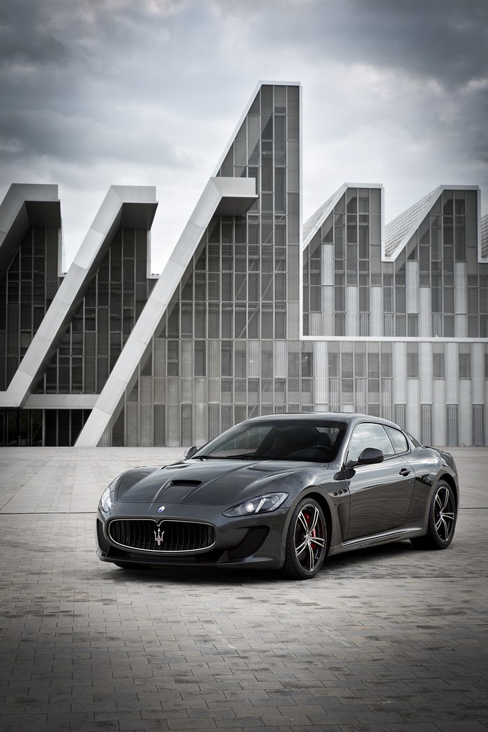 Maserati GranTurismo MC Stradale in front of modern architecture
