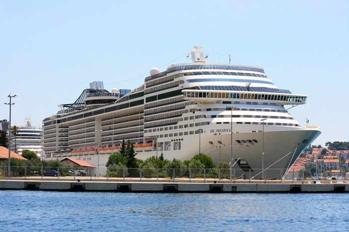 MSC Preziosa cruise liner docked at a marina