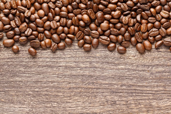 Coffee beans on a wooden surface