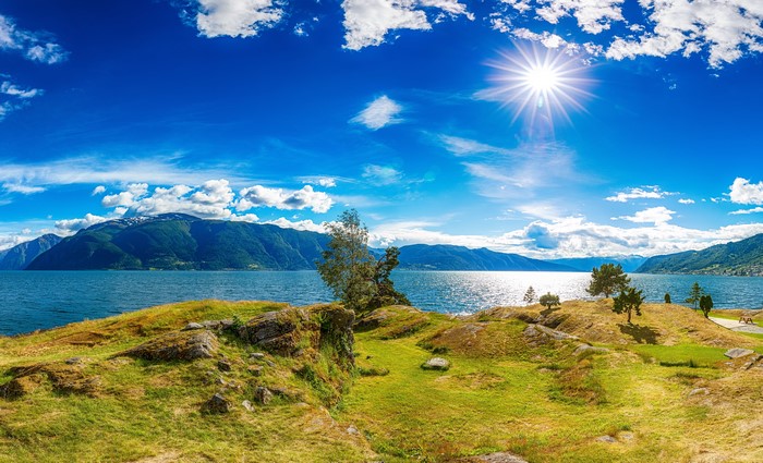 Panoramic view of a fjord in Iceland under a sunny sky