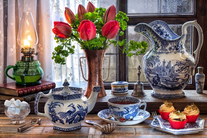 Still-life with tulips, tea set, and cupcakes