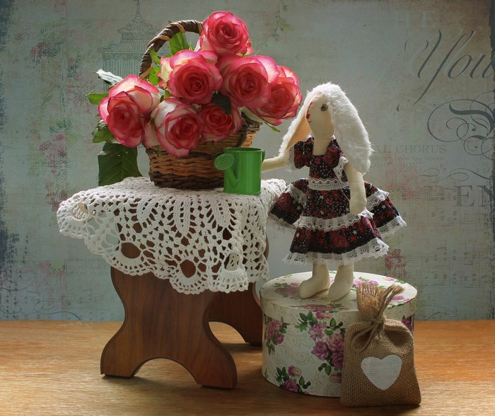 Still life with roses, doll, and basket