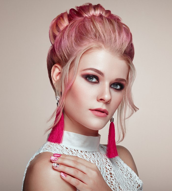 Woman with pink hair and makeup