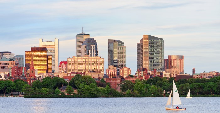 Boston skyline with sailboats on the river