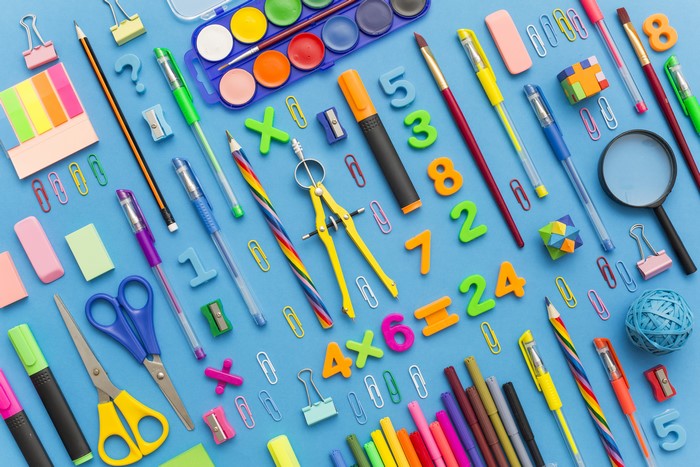 Colorful School Stationery with Scissors and Magnifying Glass