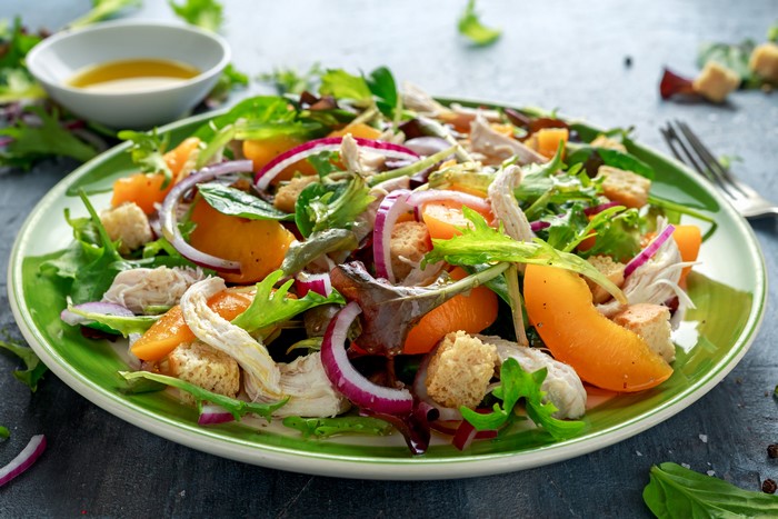 Chicken Salad with Peaches and Croutons on a Plate