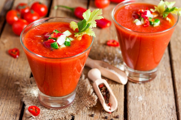 Two glasses of gazpacho with tomatoes and chili peppers